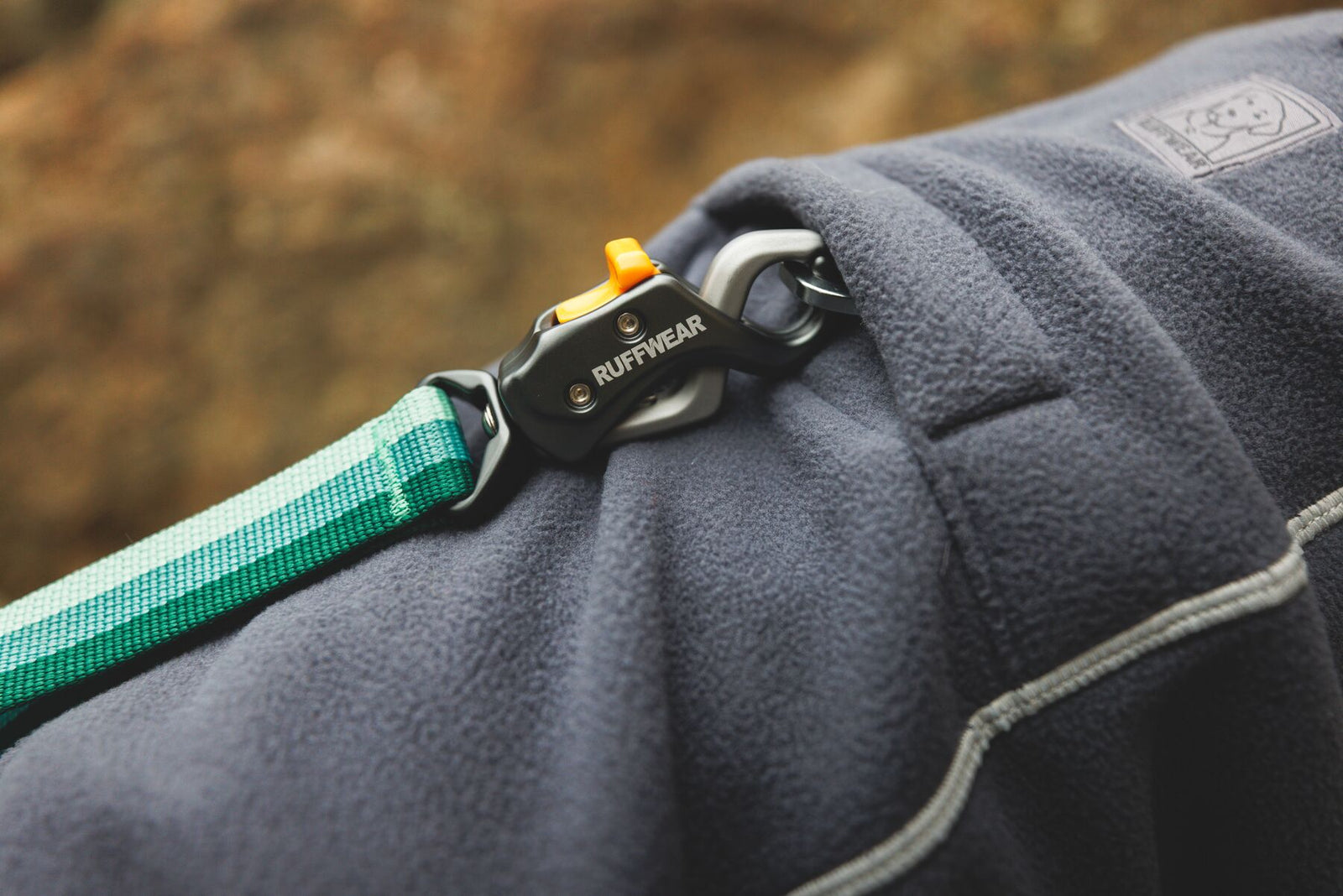 Close-up of the Ruffwear Climate Changer Fleece Jacket leash portal with lead attached