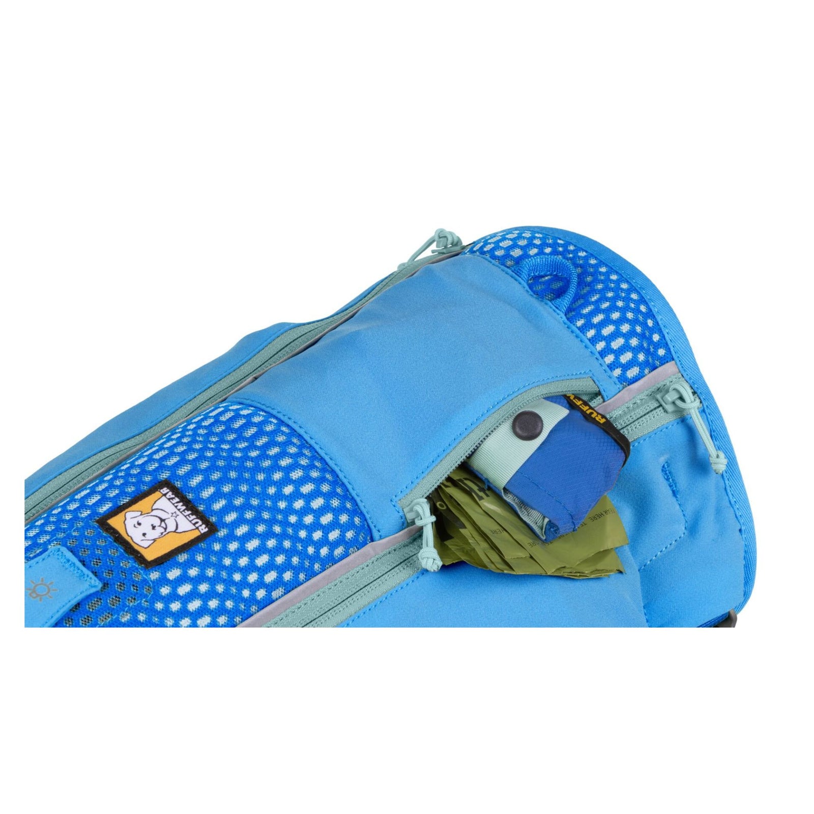 Close-up of Ruffwear Trail Runner Running Vest in Blue Pool showing zippered pocket with Trail Runner Bowl, Poop bags and included Hydrapak soft flask